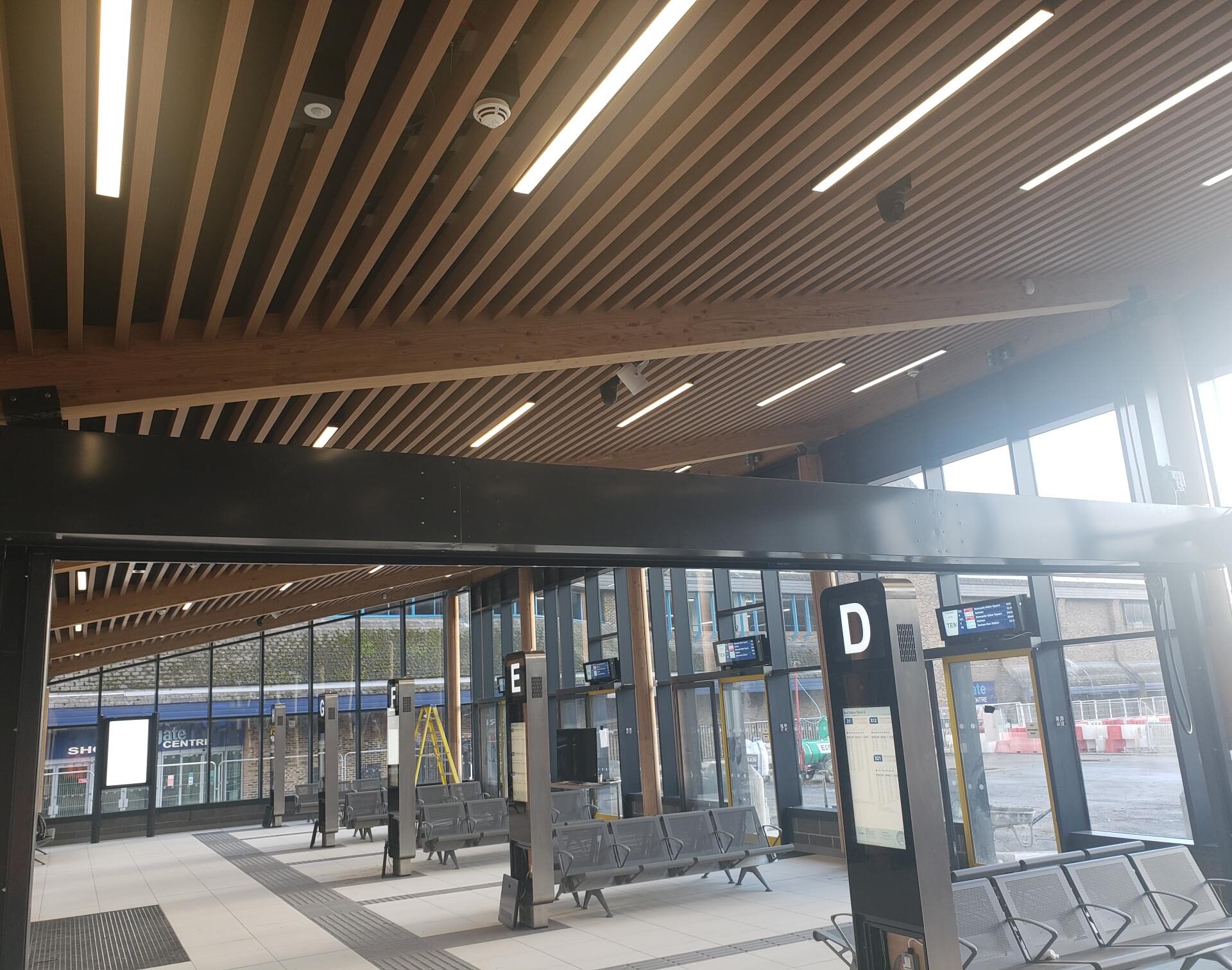 Internal image of digital display boards and seating