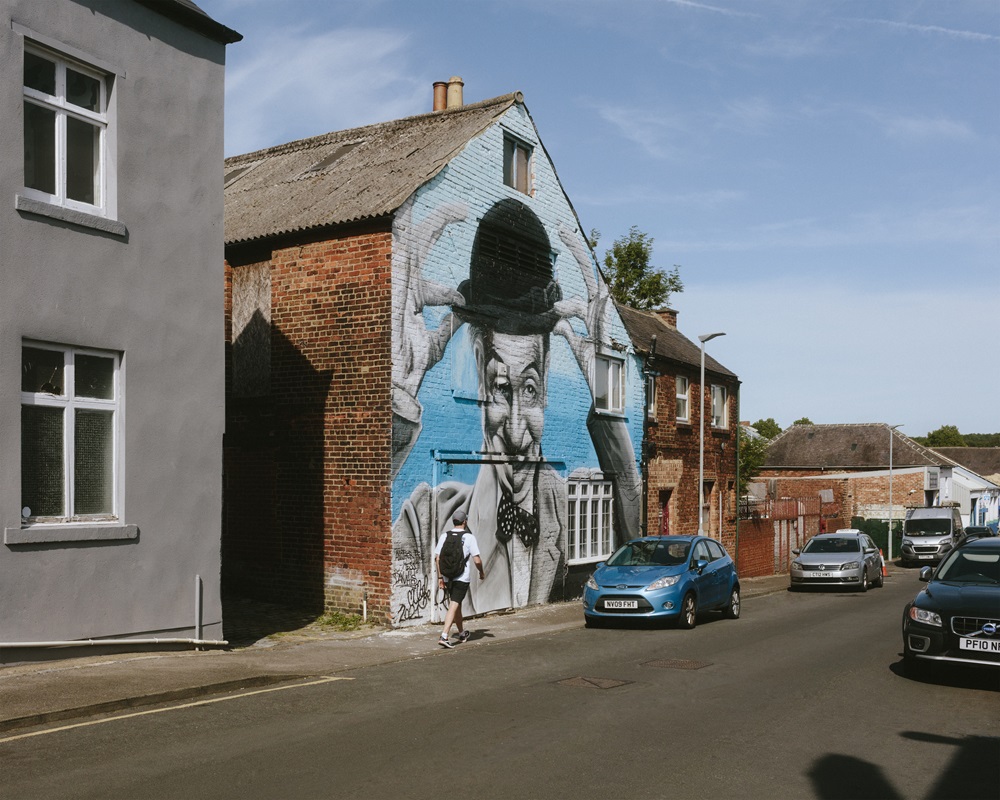 Painted image of Stan Laurel on the end of the building in Bishop Auckland