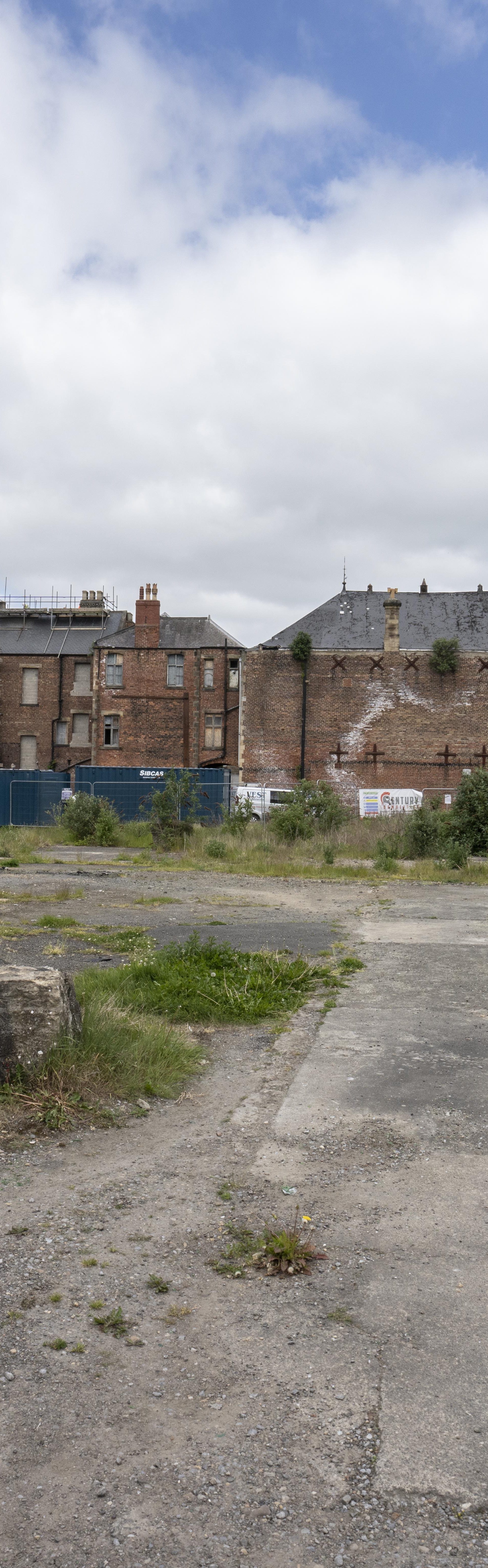 Kingsway Square land before development - image showing waste land with high street in background