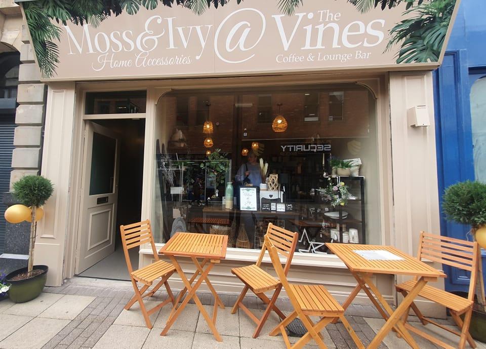 Outside Moss and Ivy shop front on Newgate Street after transformation including outdoor seating