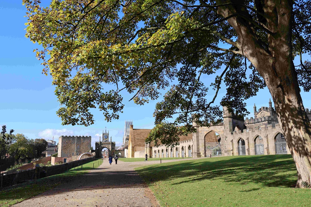 Auckland Palace to the right of the image with the boardwalk running down the centre of the image leading to the clock tower