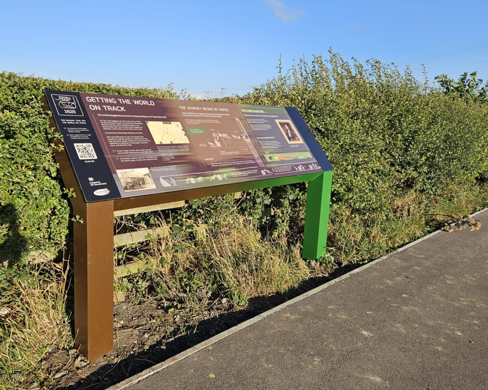 One of the new interpretation panels that have been installed along the route. Panel showing history of that section of route set back into ground off the path.