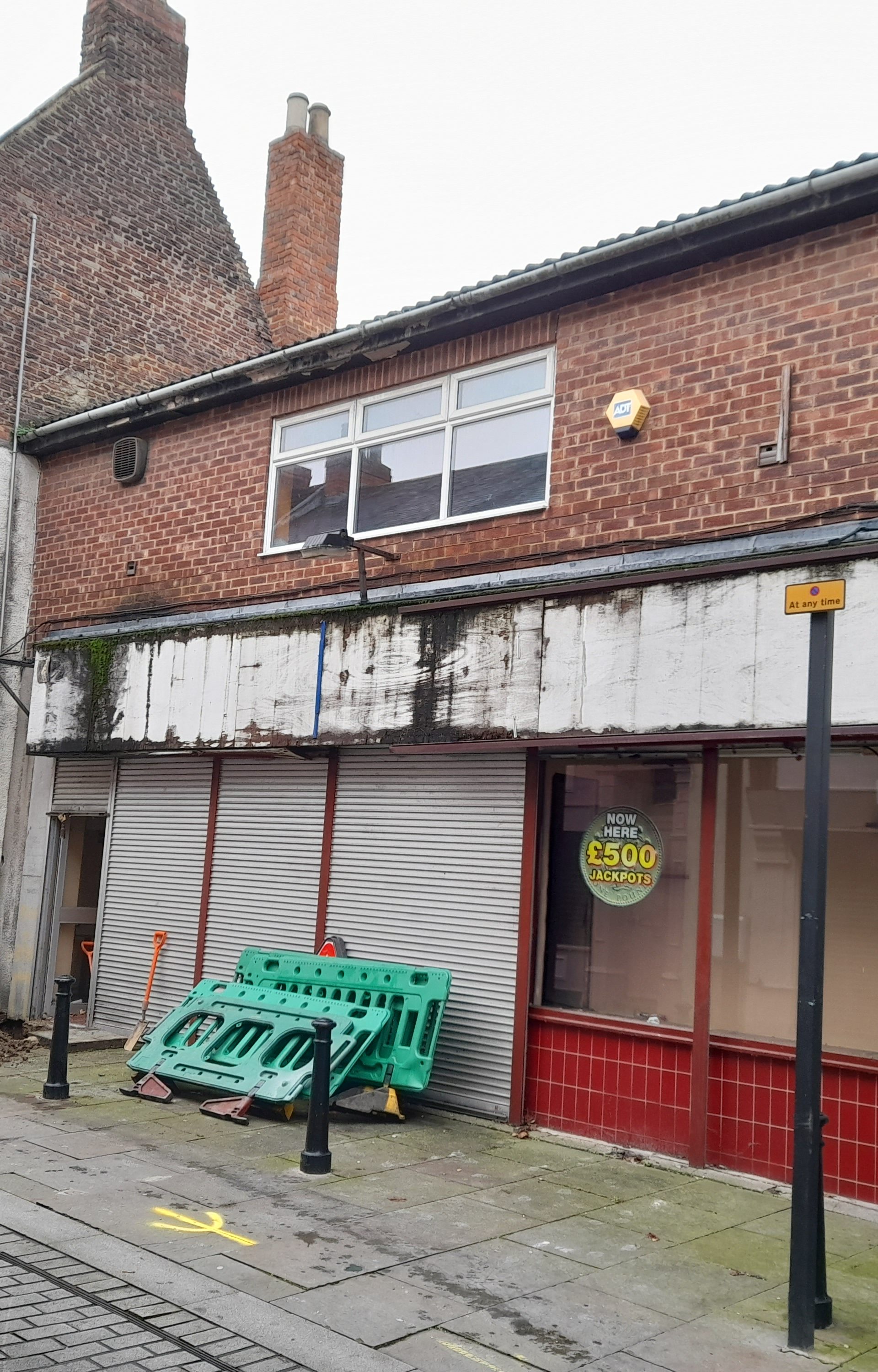 Before image of derelict Building on North Bondgate to Fore Bondgate with white shutters and white sign above the windows