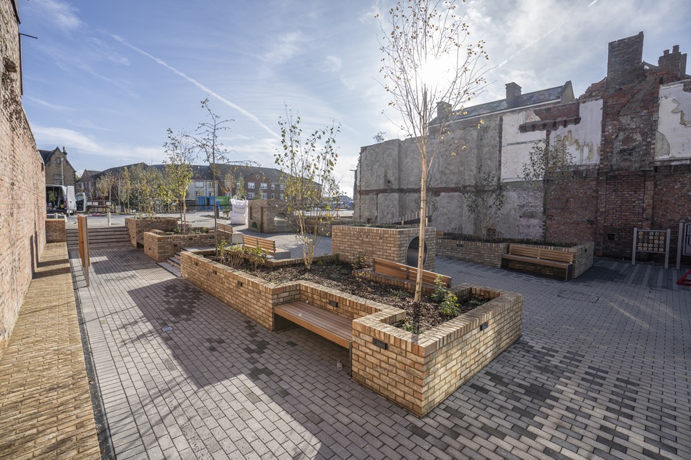 View of Kingsway Square complete with planters and brick seating areas