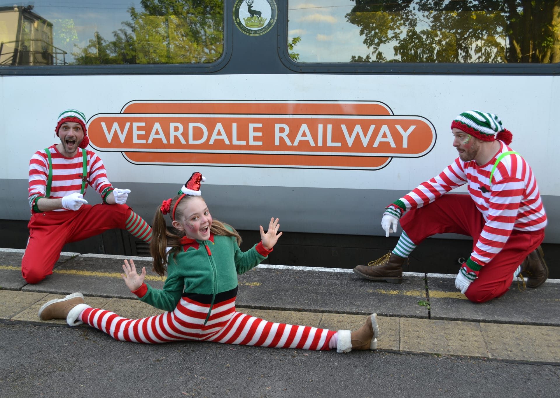 Christmas Elves sat in front of Weardale Railway Train