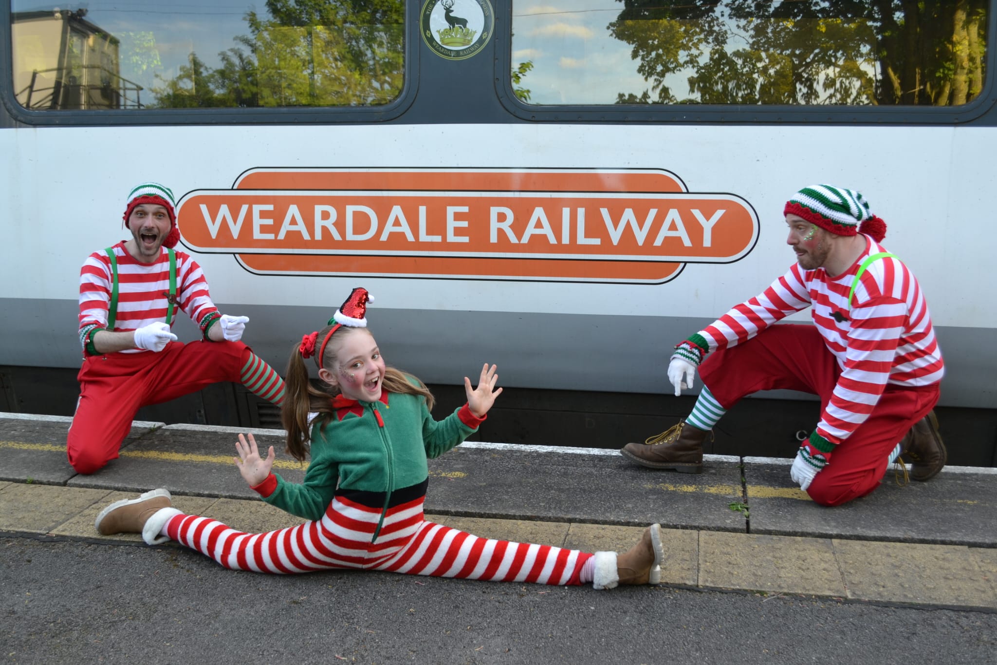 Christmas Elves sat in front of Weardale Railway Train