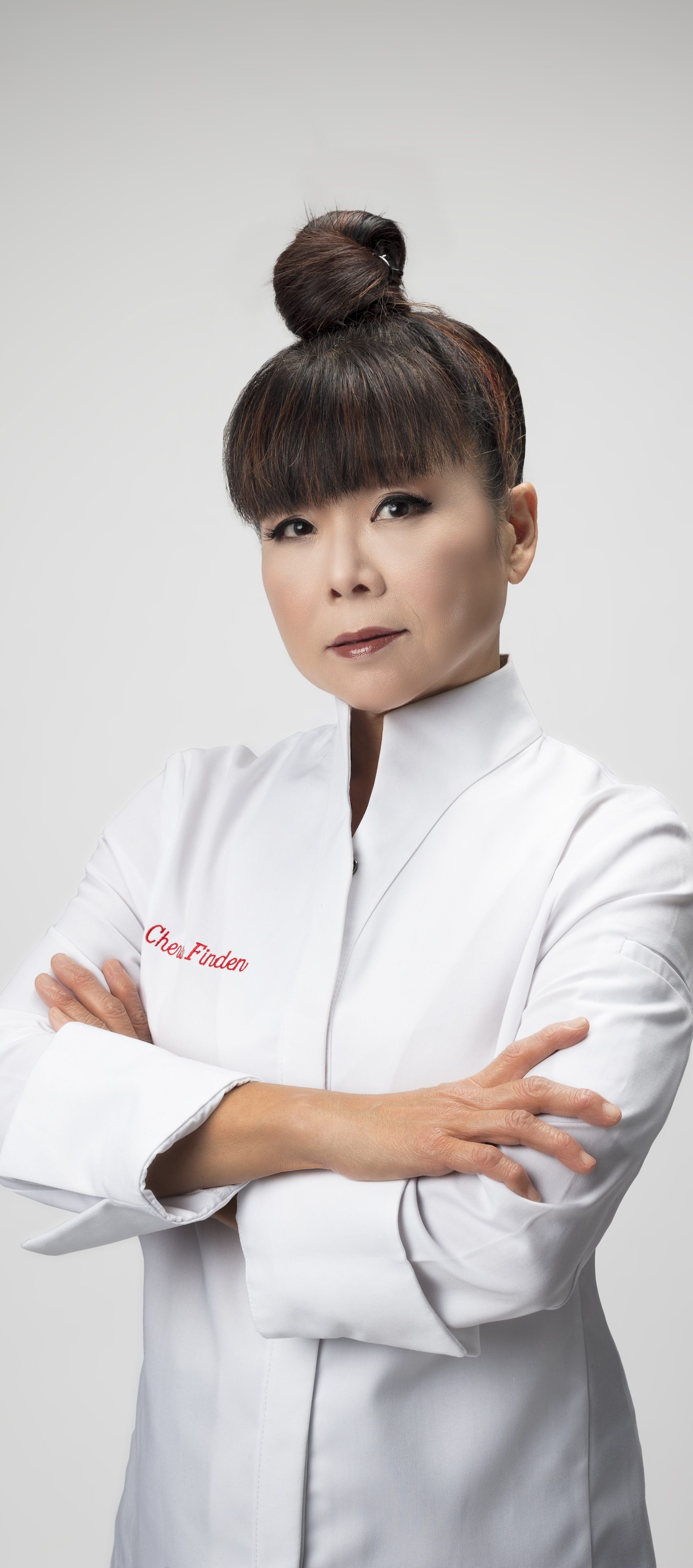 Cherish Finden standing in chef whites with arms crossed