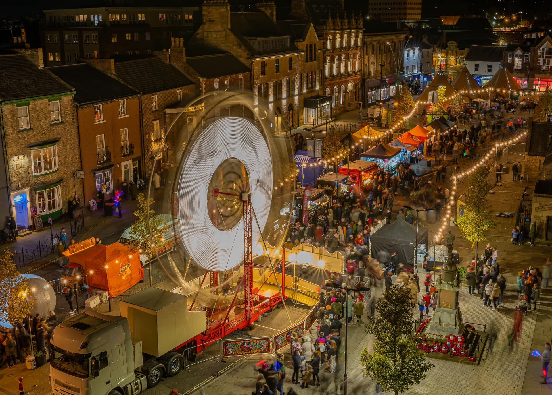 Aerial shot of large Ferris wheel in the centre of Bishop Auckland as part of their Christmas Town activity
