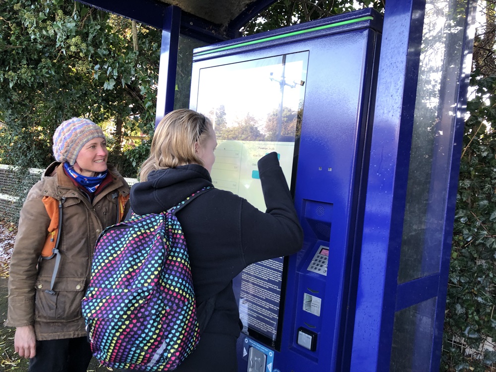 Participant using the train ticket machine