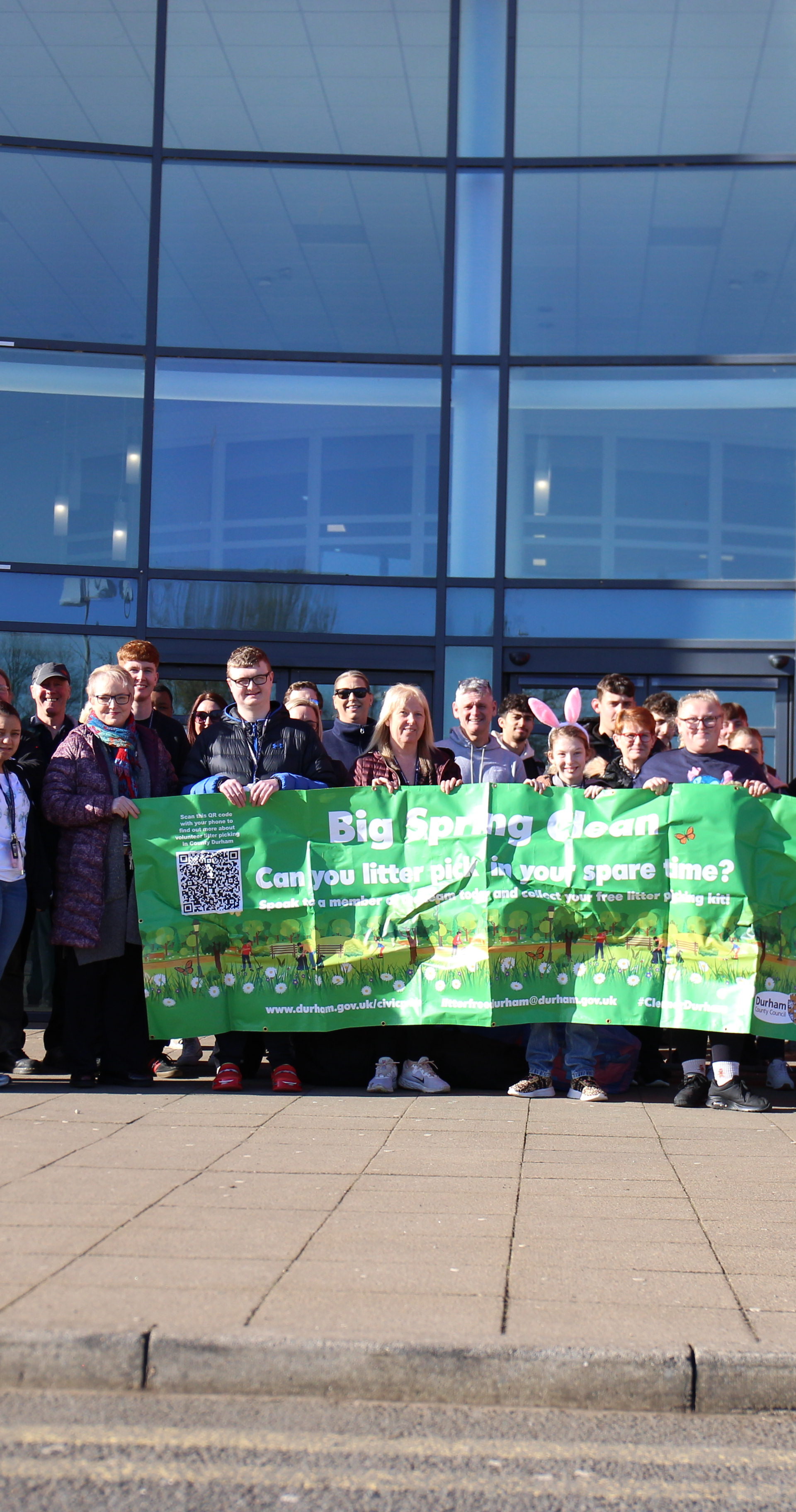 Students from Bishop Auckland College Holding a banner promoting the Community Action