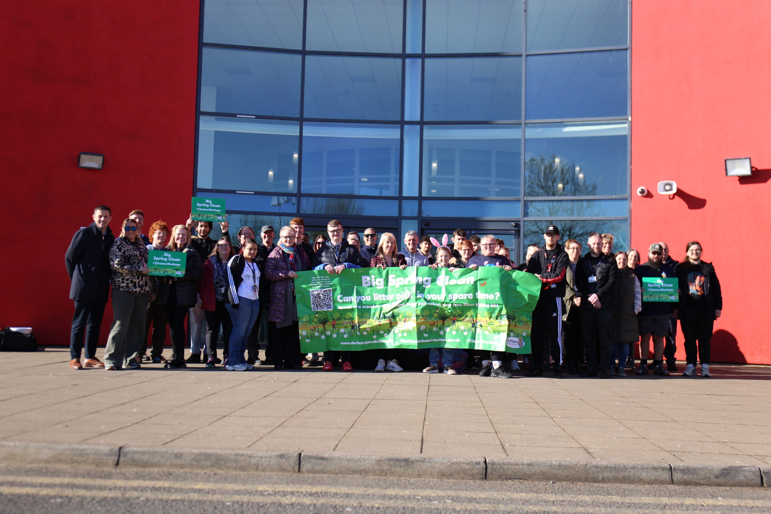 Students from Bishop Auckland College Holding a banner promoting the Community Action
